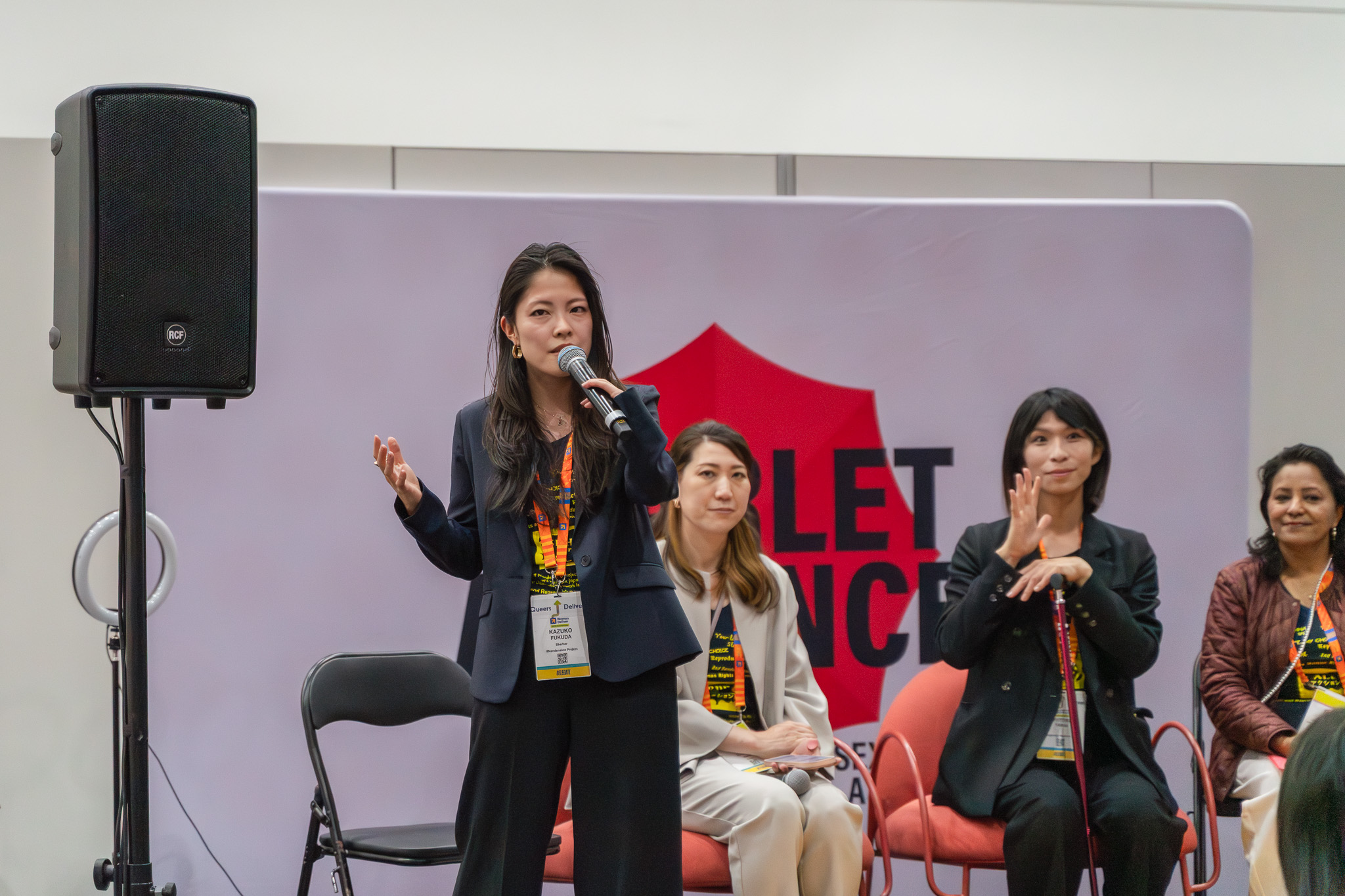 Women Deliver 2026会場でスピーチする＃なんでないのプロジェクトの福田和子さん